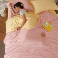Completo letto in cotone a fibra lunga — rosa cipria e giallo crema